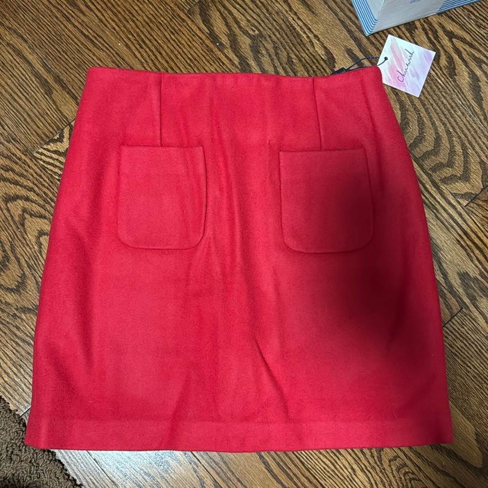 Brand new, never worn, with Tabs Chicwish Mini Skirt. Color: Red. Size: Small.